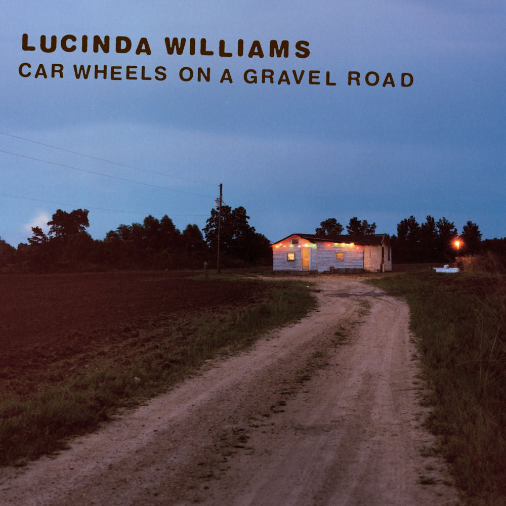 Car Wheels on a Gravel Road cover